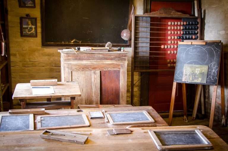 Photo of a classroom with abacus and blackboard.