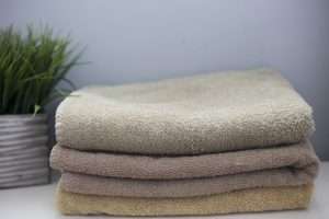 Folded towels on a counter.