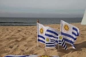 Uruguay flags on a beach
