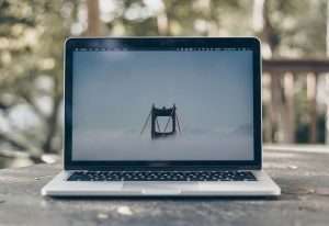 Laptop computer on a table outside.
