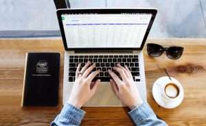 Person typing on a computer.