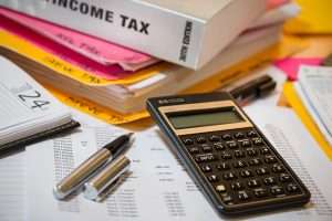 Income tax papers with a calculator.
